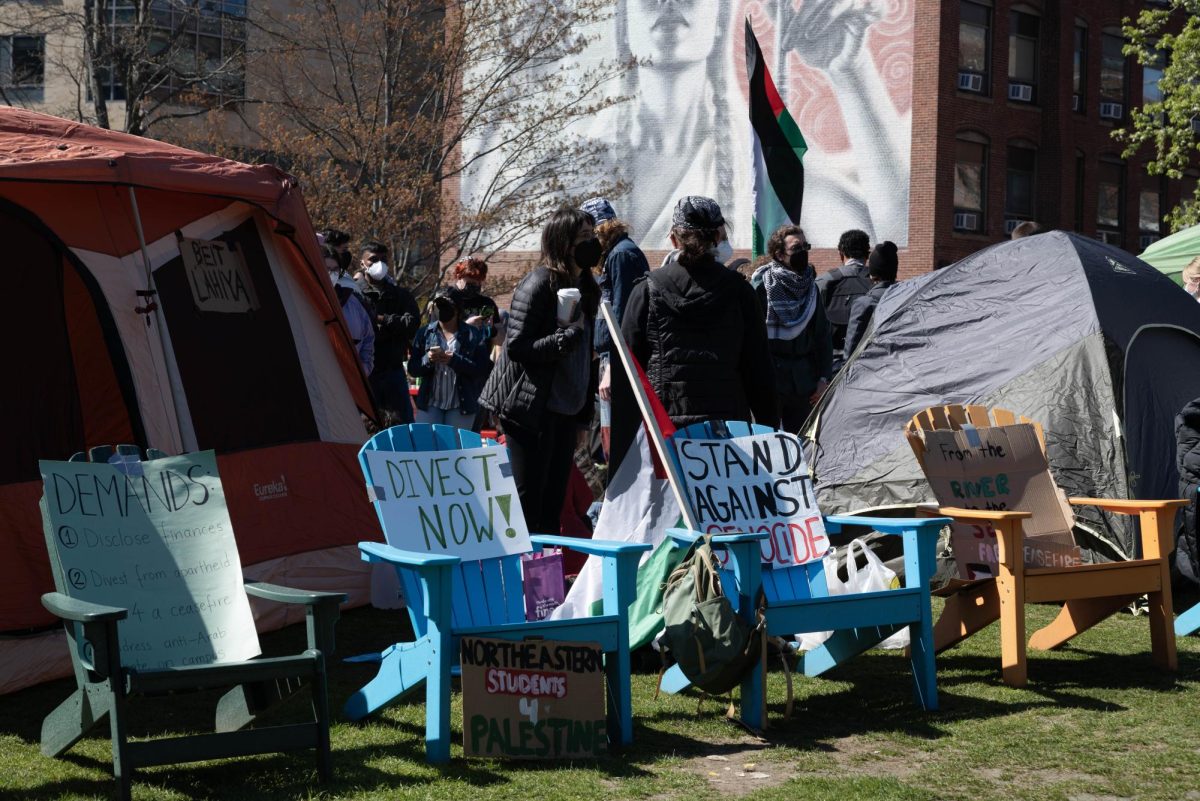 Chairs with handmade protest signs surround the outside of the pro-Palestine encampment on Centennial Common April 26. JAG expressed gratefulness to university leadership and the NUPD for ending the encampment in a statement emailed to the News.