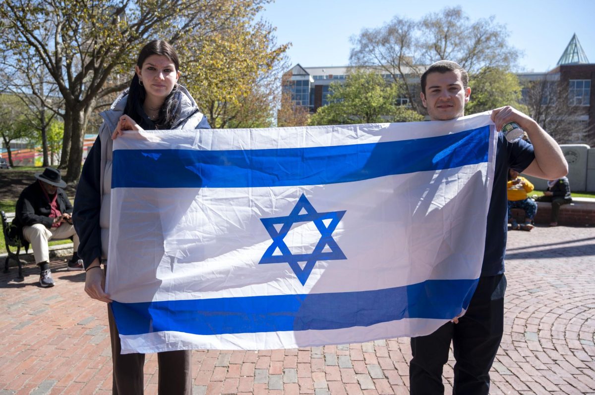 Kislin and Alcufron hold up an Israeli flag.