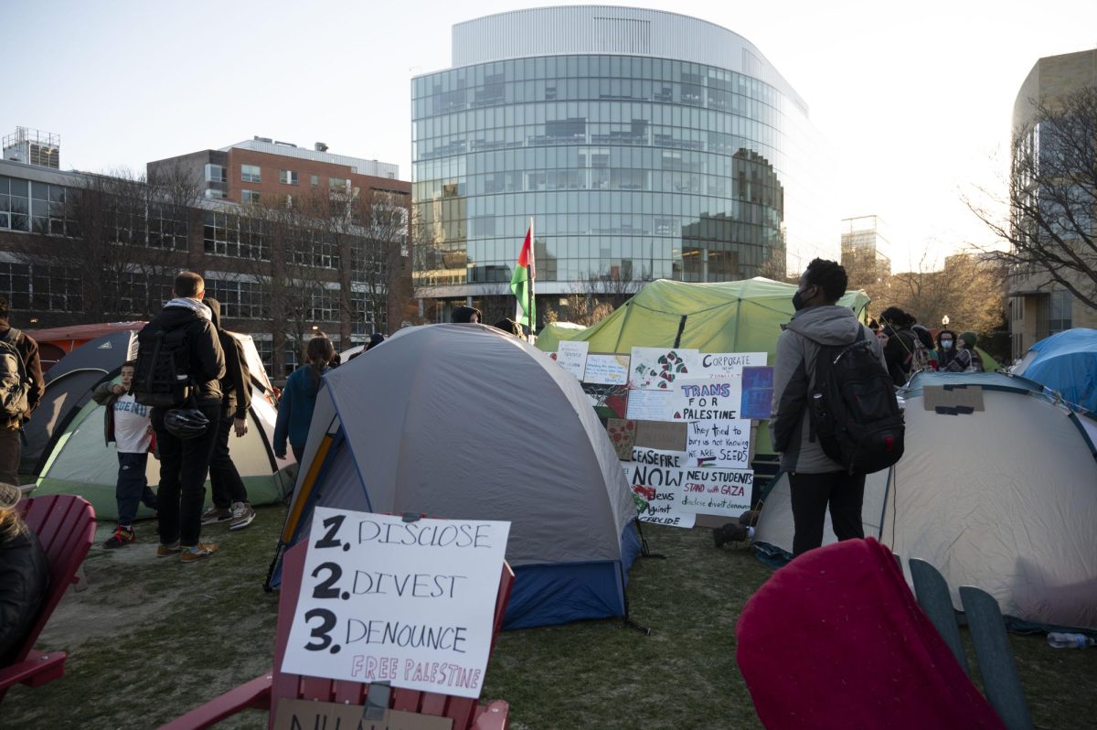 Protest signs and tents fill the encampment on Centennial Common. Power to Centennial Common was shut off around 6:50 p.m.