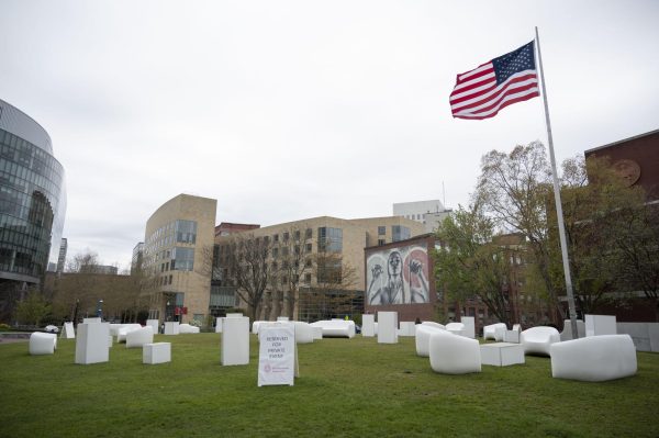 White chairs sit on Centennial Common along with a sign that reads, Reserved for Private Event. Northeastern facilities staff removed the barricades surrounding Centennial Common at 1:30 p.m. Monday.
