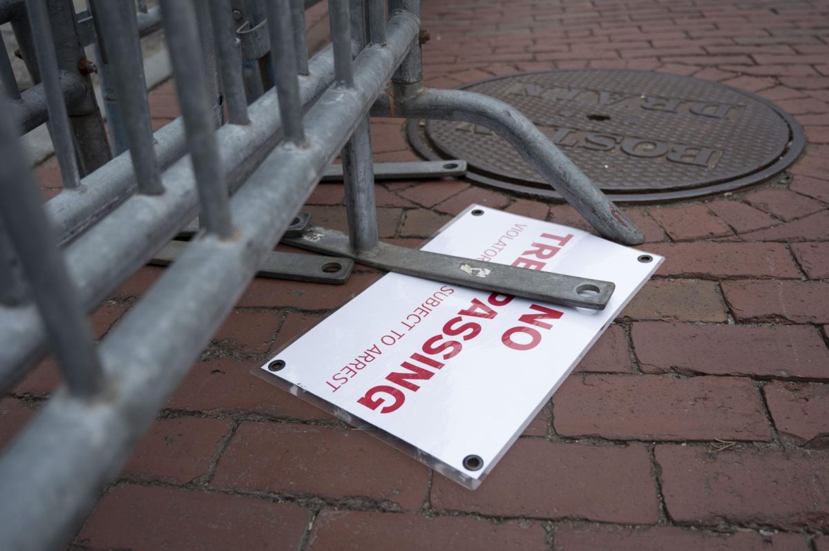 A No Tresspassing sign sits on the floor after being removed from the barricades that once blocked off Centennial Common.