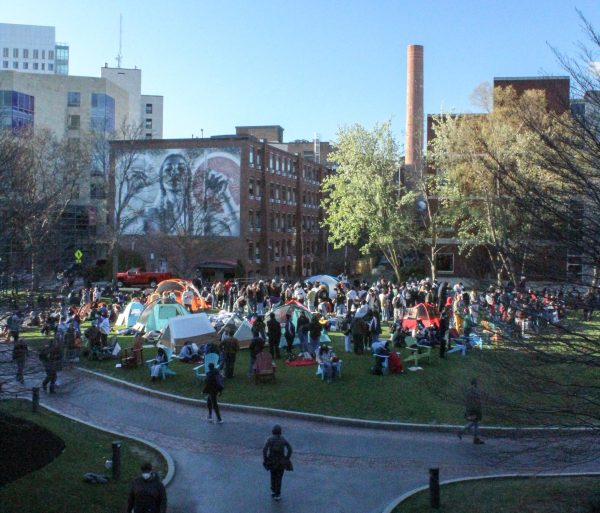 Pro-Palestine protesters gather, pitch tents and rest April 25 around 6 p.m. during the encampment. Northeastern University released a statement April 29 regarding the administrations thoughts on the encampment. 