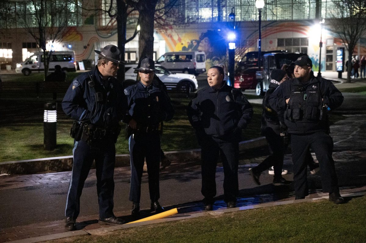 State troopers and NUPD officers discuss the encampment around 4:00 a.m. Protesters began to anticipate an imminent police raid.