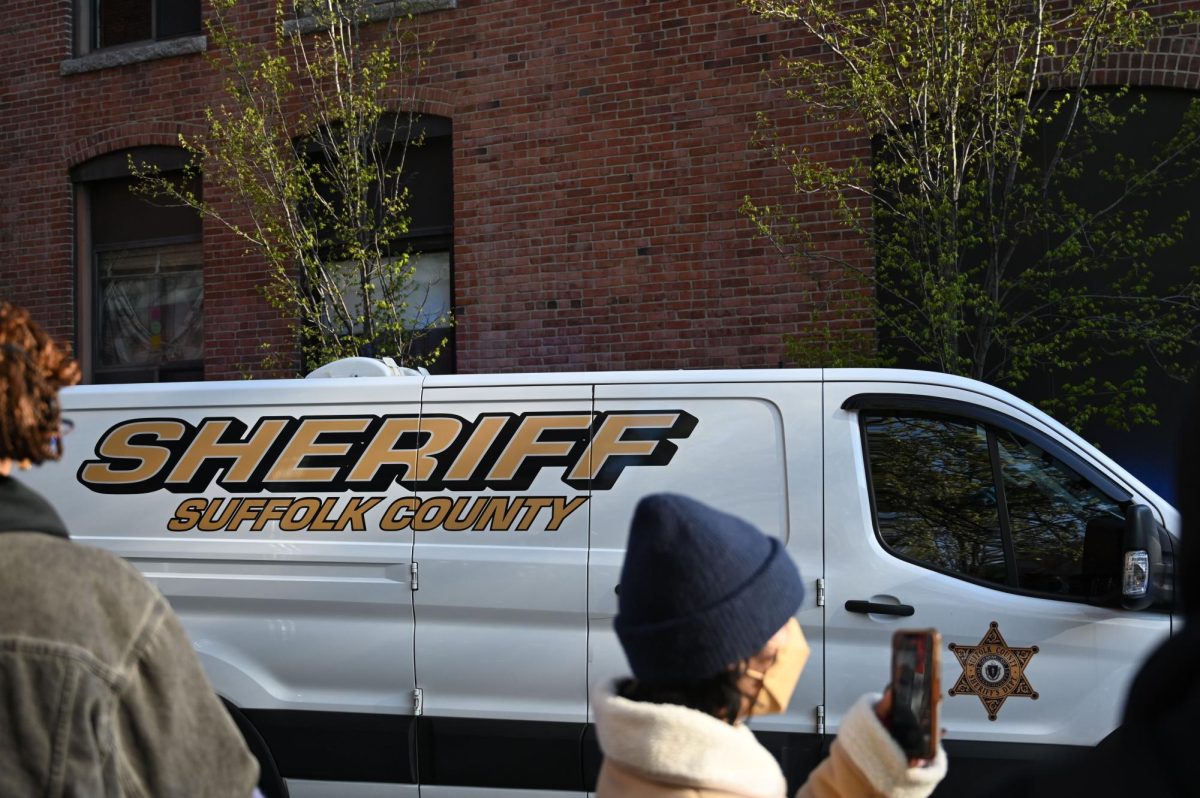 A  Suffolk County sheriff van waits near Forsyth Street. Police began to move protesters into sheriff vans at around 7:35 a.m.