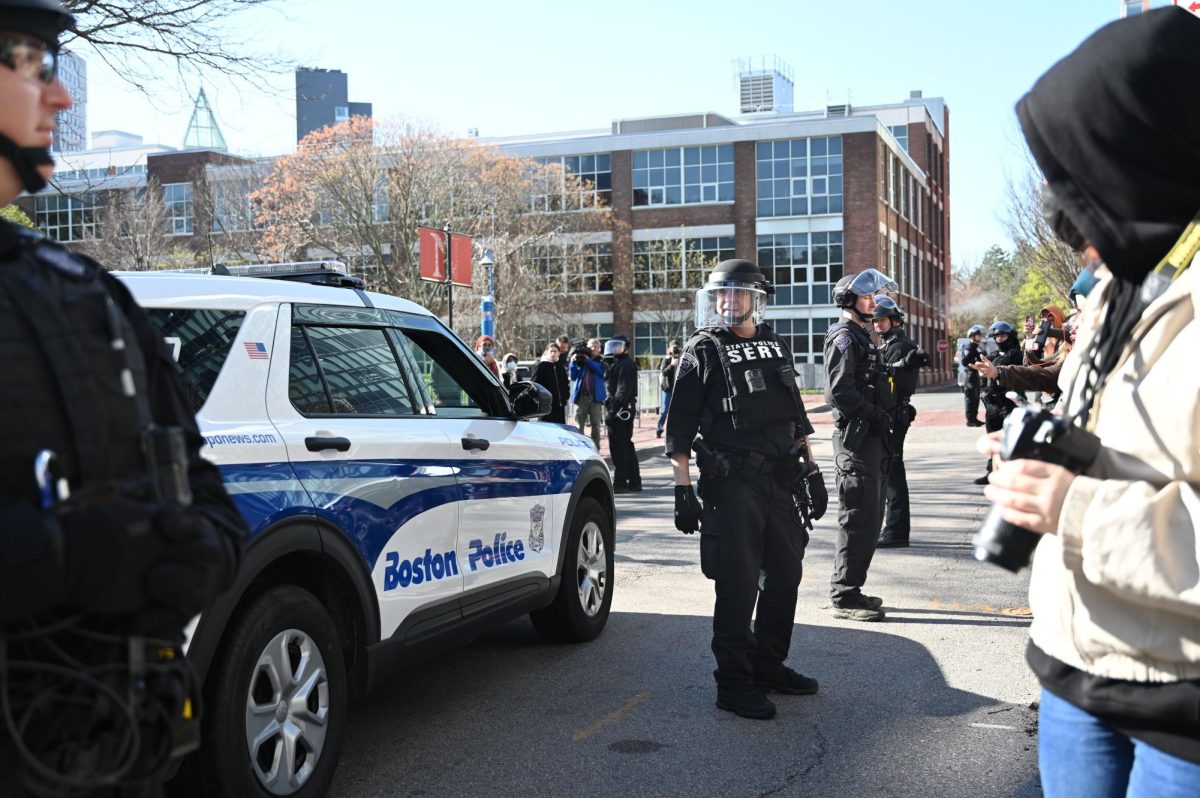 State police officers line up on Leon Street. The street was used as an alternate route to exit campus.