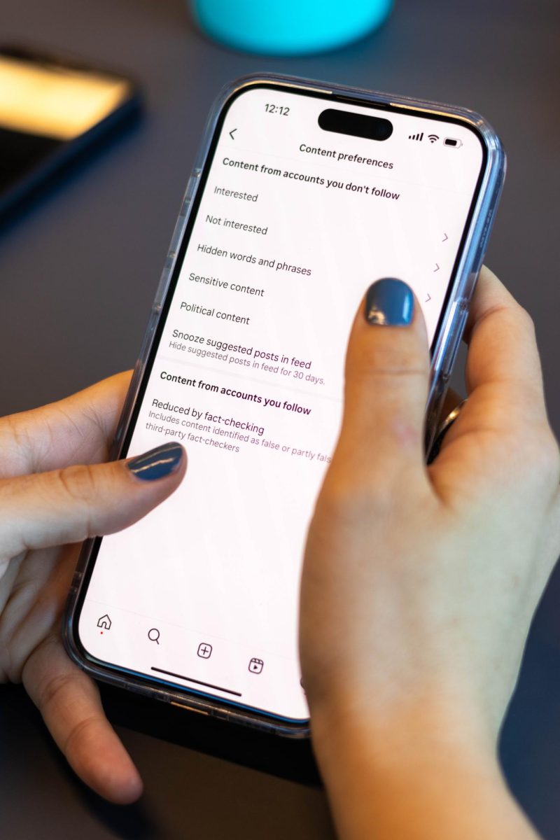 A student examines the content preferences page in Instagrams settings. Instagram started limiting “political” and “social” content for users by default in mid-March with no announcement.





