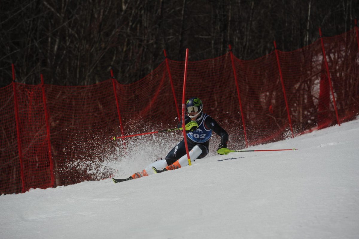 A Husky slides down the slope during competition. Northeasterns mens team finished 11th at the national championship, and the women placed 15th. Photo courtesy Tom Martin.
