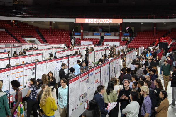 Students present research and creative projects to members of the Northeastern community at the RISE Expo in Matthews Arena April 11. Over 400 undergraduate and graduate students attended the event.
