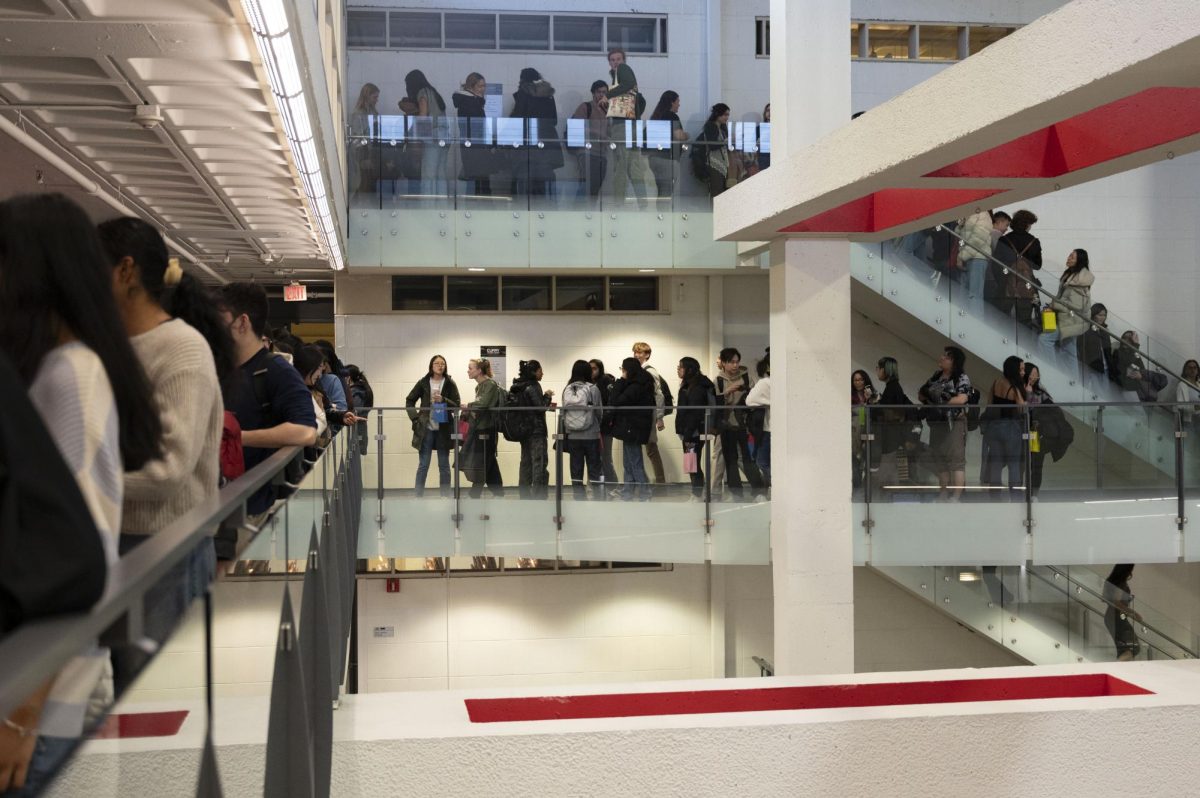 A line of students waiting for merchandise spans two floors of Curry Student Center. Hundreds of students attended the Cuplympics Carnival.