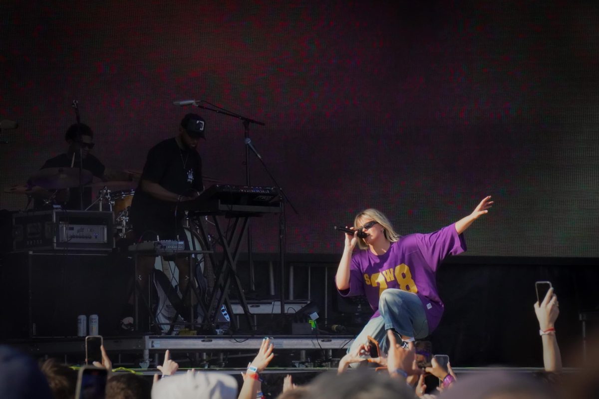 Rapp kneels on stage while performing. Rapp told the audience she “no longer hates Boston” in reference to her 2023 song “I Hate Boston” from her “Snow Angel” album.