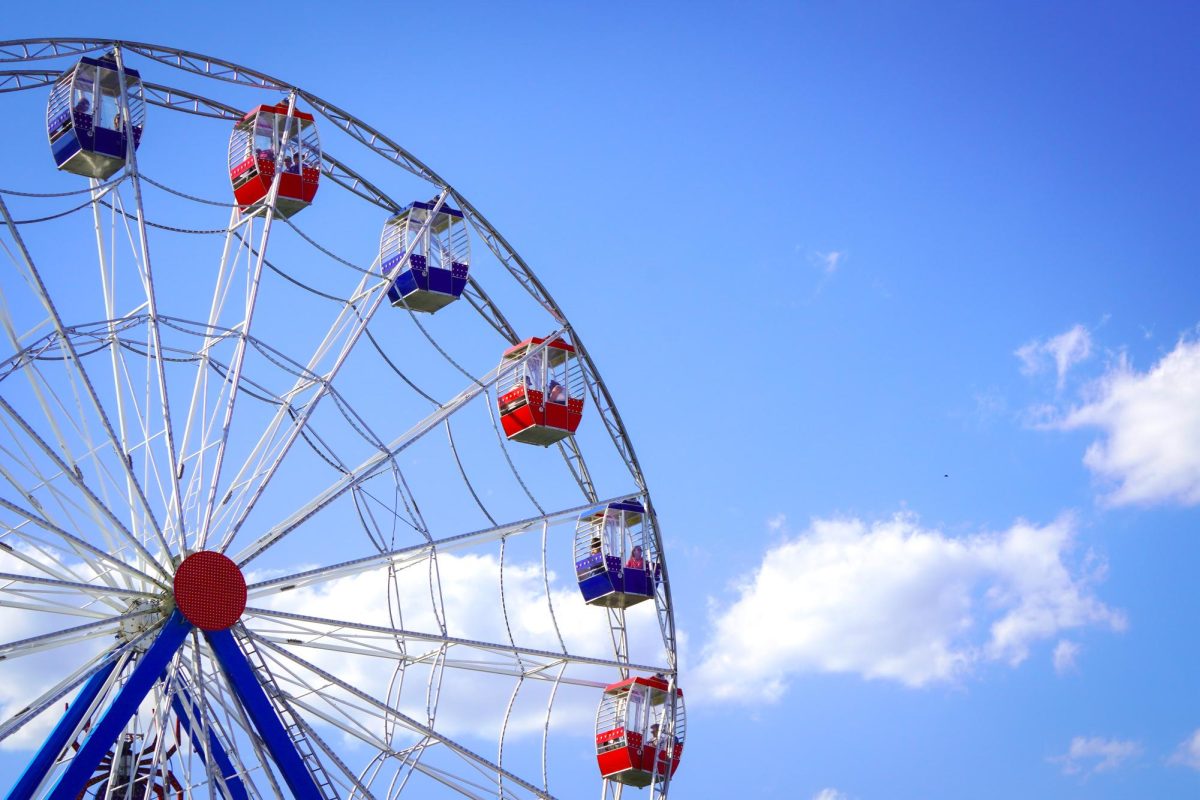 A 100-foot tall ferris wheel stands over the festival grounds. The ferris wheel gave riders a bird’s-eye view of the performances. 