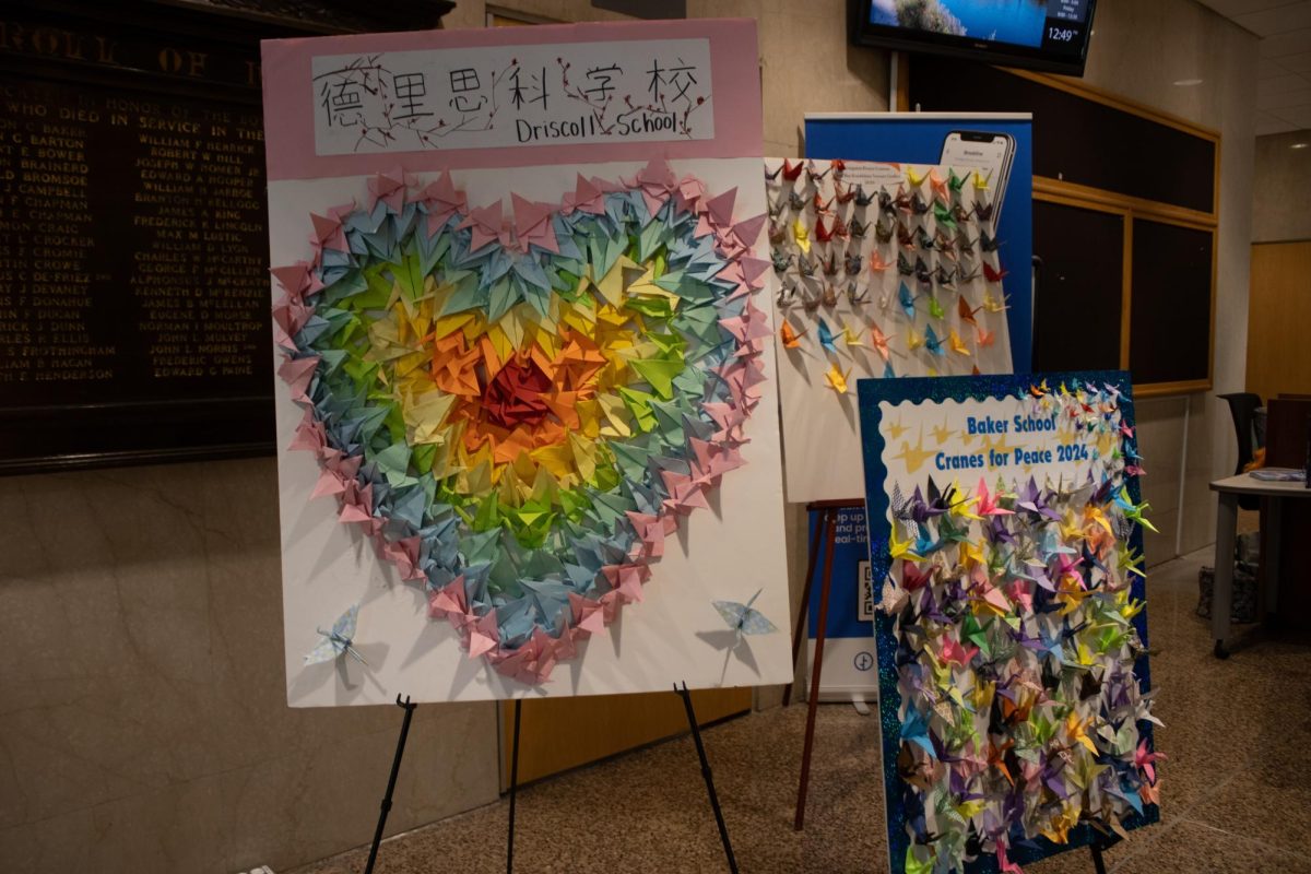 Origami crane projects from the Driscoll School, Brookline Senior Center and Baker School are displayed. Showcased at the front of the event, the Cranes for Peace project was used to symbolize unity and togetherness. 