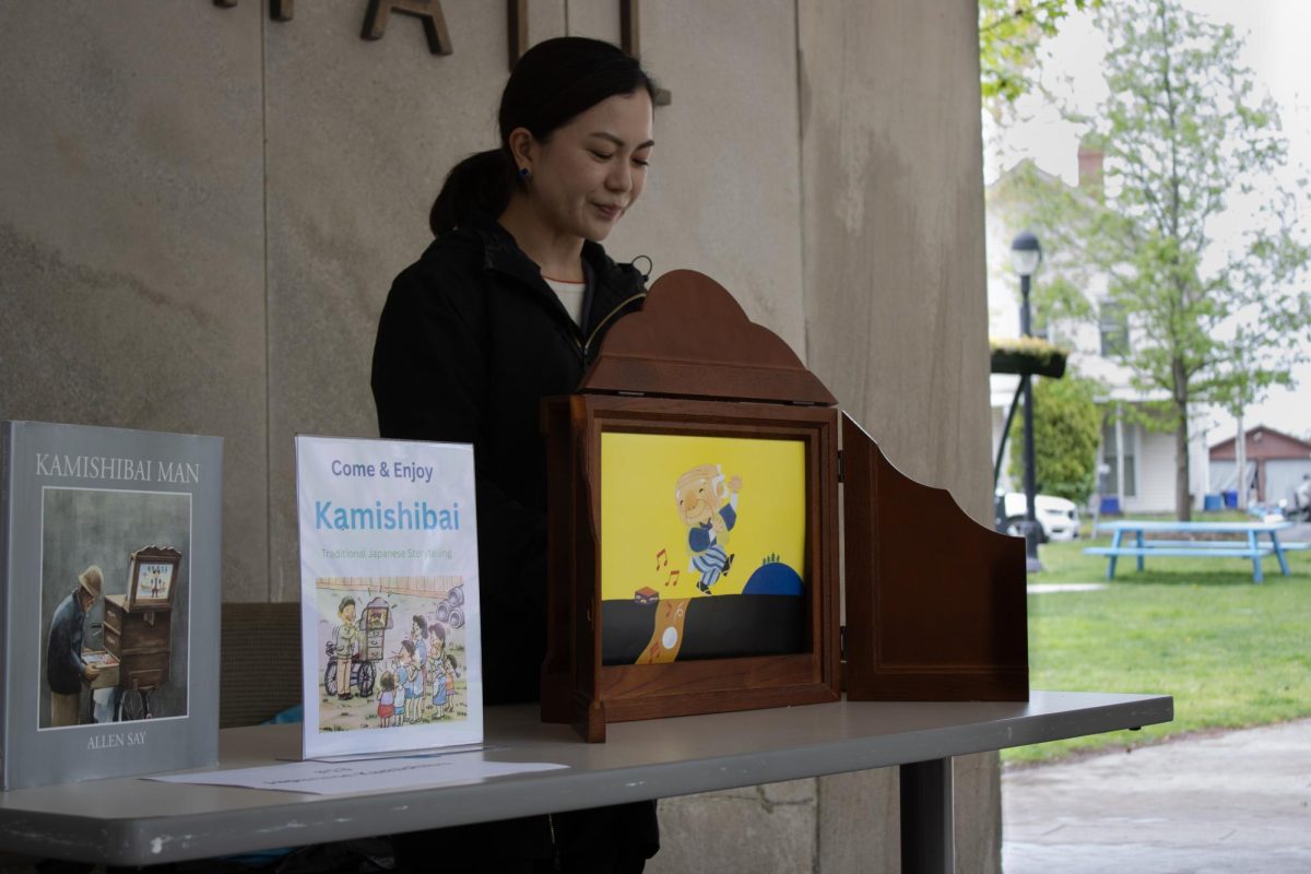 One narrator reads the book “Kamishibai Man” by Allen Say. The story was told using kamishibai, a form of Japanese storytelling that uses illustrated paper cards and a narrator.