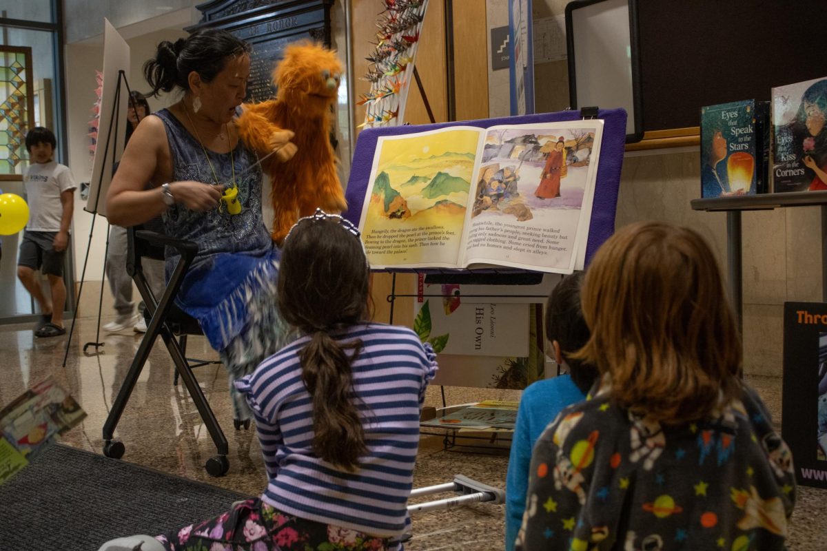 Leigh Baltzar of Through Me To You Puppetry reads stories written by AAPI authors. Children listened to books including “Eyes that Speak to the Stars” and “Eyes that Kiss in the Corners” by Joanna Ho.