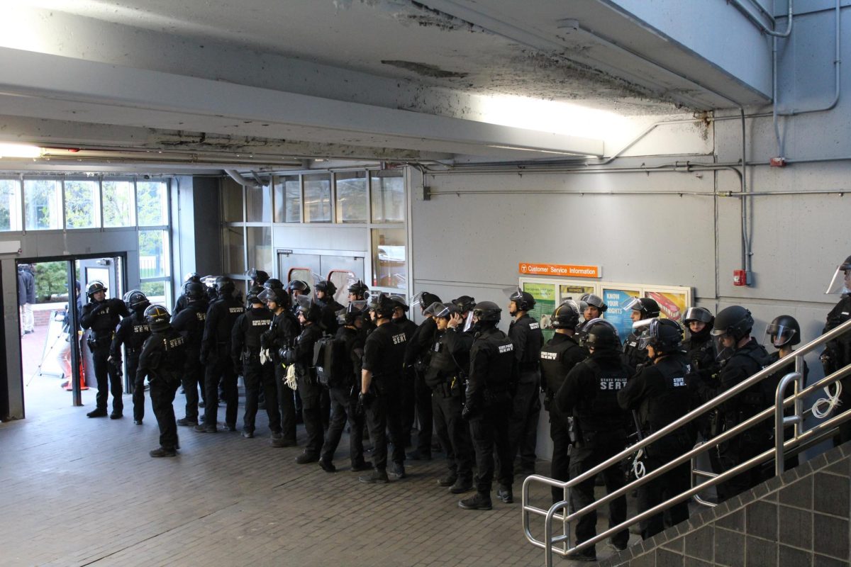 State police officers line up in Ruggles Station in preparation to arrest protesters. Around 7 a.m., they deployed from Ruggles and surrounded the encampment.