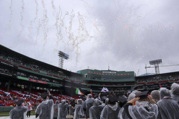 The class of 2024 watch as fireworks explode over Fenway Park during the undergraduate commencement ceremony May 5. Many members of the graduating class started college during the COVID-19 lockdown, a theme mentioned in many speakers speeches.