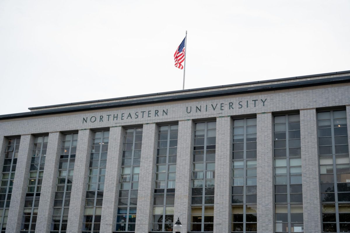 An American flag flies on top of Ell Hall on Northeastern’s Boston campus. The university announced a new merger with Marymount Manhattan College May 29.