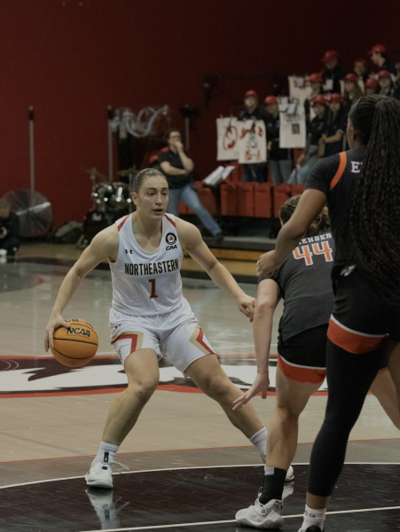 Derin Erdogan looks for an offensive opportunity in a game earlier this season. The senior led the Huskies in total points (420), assists (118), steals (39) and three-pointers (60) for the 2023-24 season.