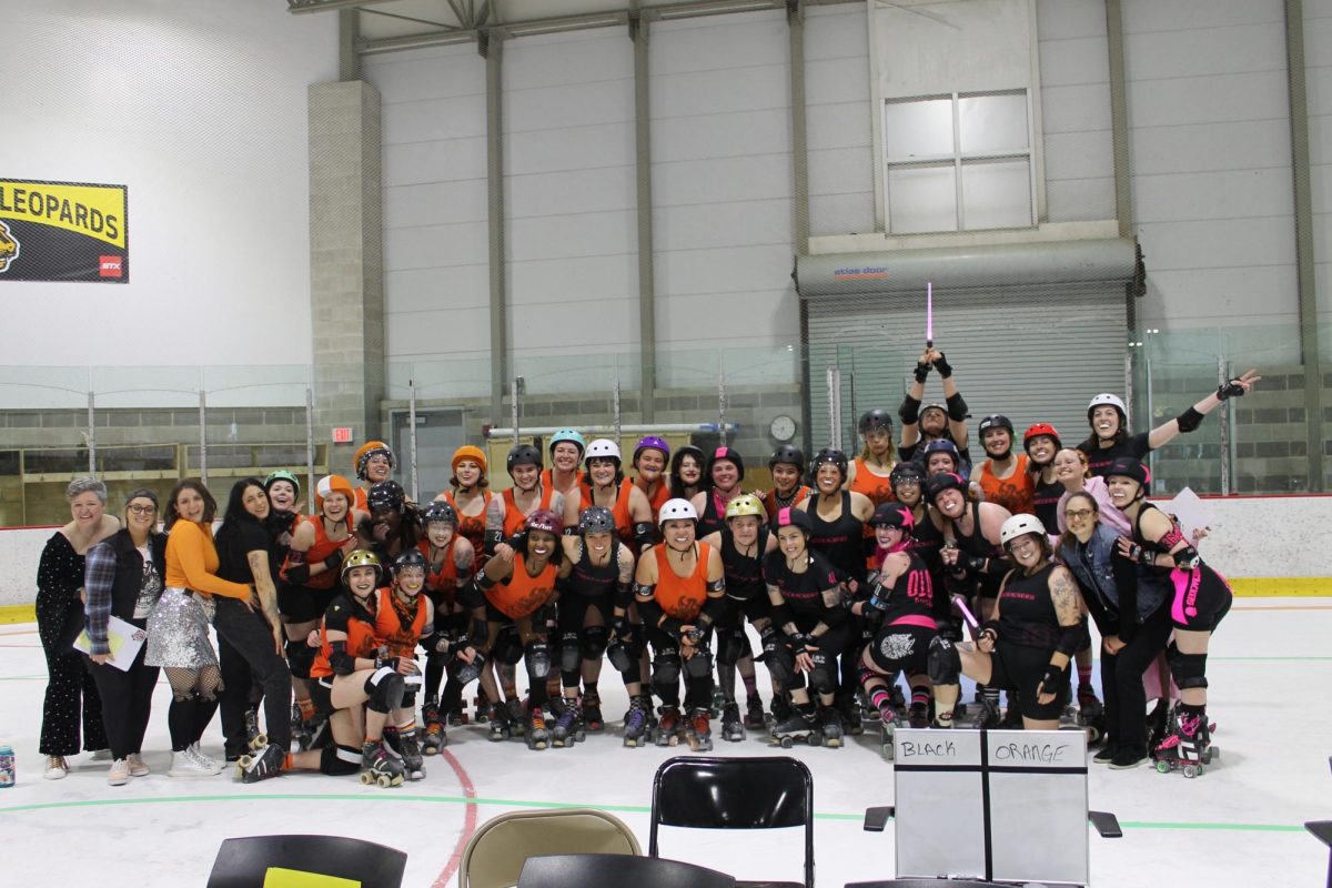 Members of the Disco Infernals and the Nutcrackers link shoulders for a joint-team photo after their game. The final score ended at 182-146, but from their faces, there was no way to guess who won from who didn’t. 