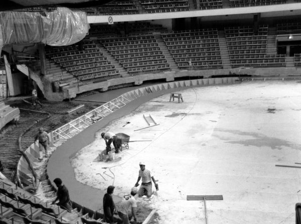 Employees work on the rink floor of Matthews Arena. Matthews Arena opened for the first time in 1910 for an ice carnival, and is now the worlds oldest artificial ice sheet. Photo courtesy Northeastern University Archives and Special Collections.