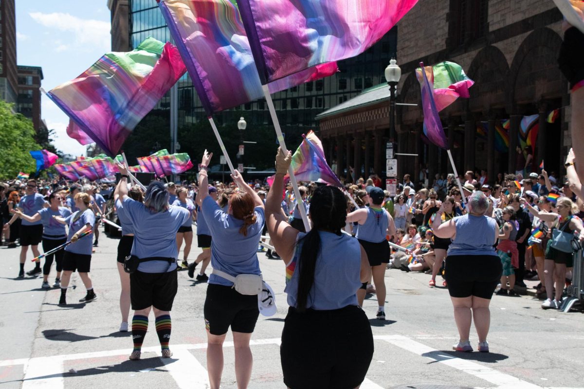 The New England Pride Colorguard spin colorful flags to the delight of the crowd.