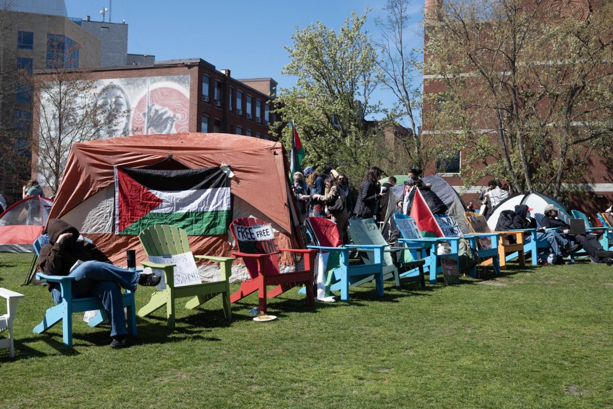 Protesters sit in chairs around the encampment. HFP announced in a May 16 Instagram post that 30 students in total received disciplinary action charges from OSCCR.
