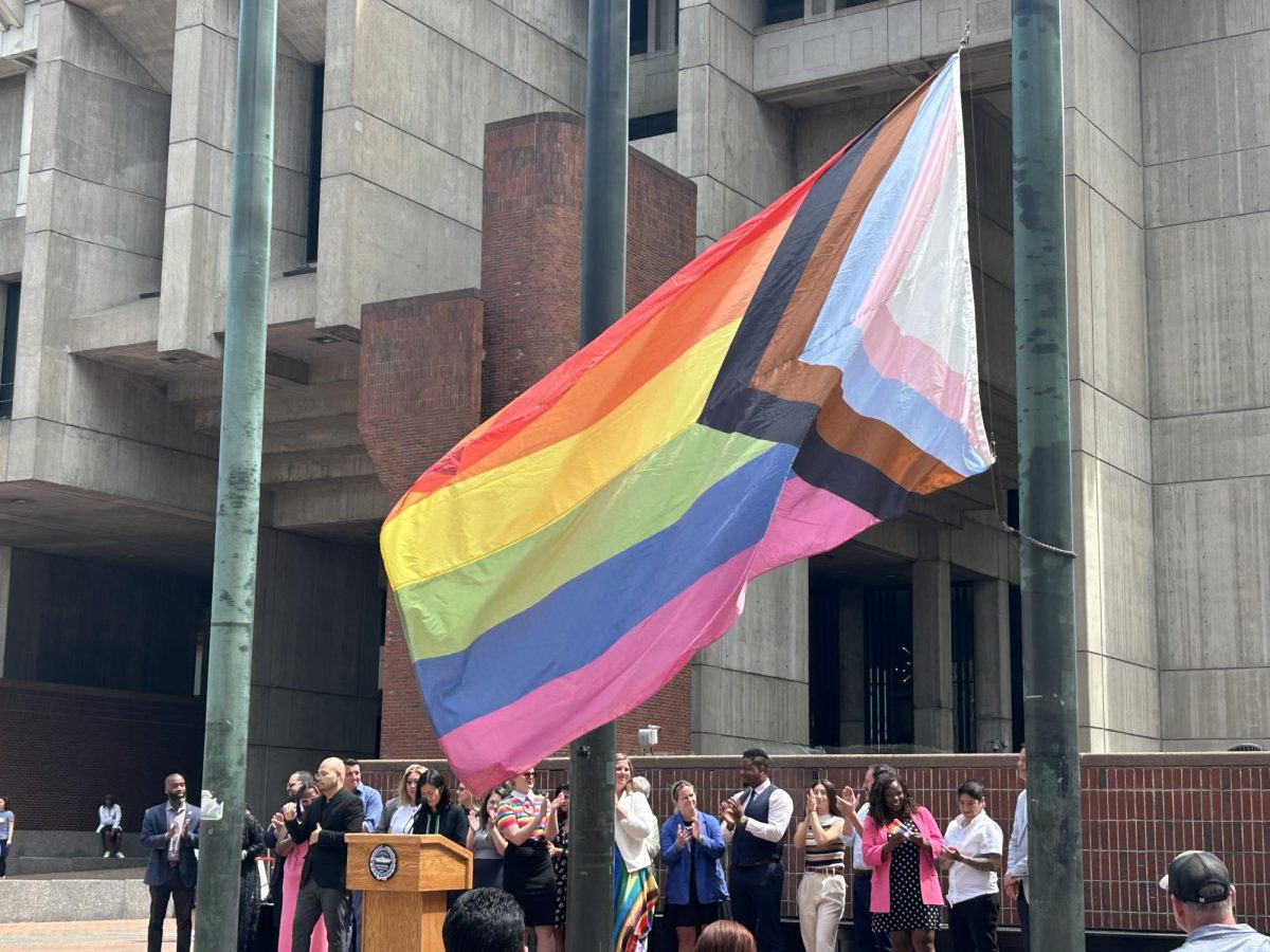 Spectators clap as a pride flag is raised outside City Hall. The city of Boston held a pride flag raising ceremony June 3 to kick off the 2024 Pride Month.