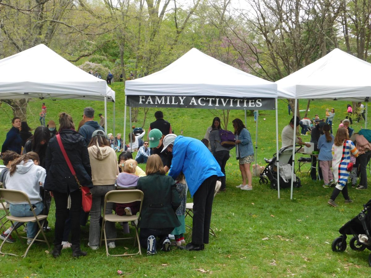 Children and their families partake in the family activities station. The station involved several interactive activities like arts and crafts.