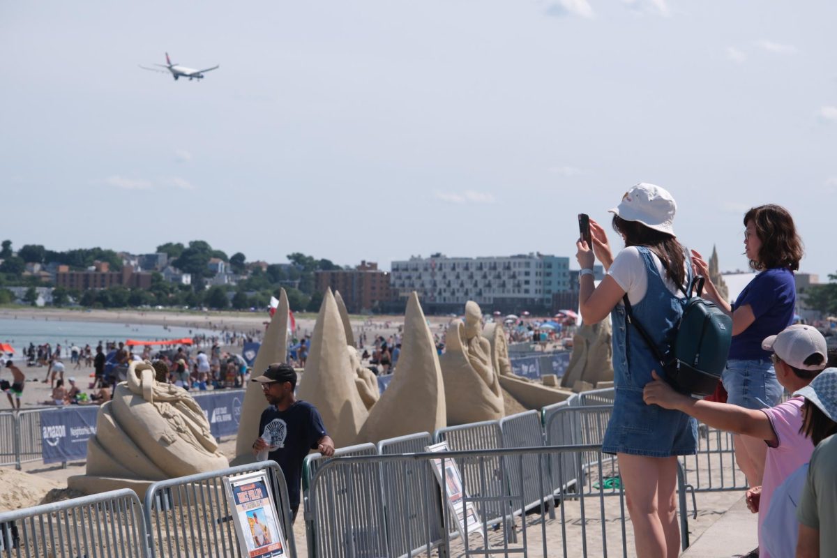 Visitors spectate and photograph their favorite sculptures during the Sand Sculpting Festival July 20. Read more here.