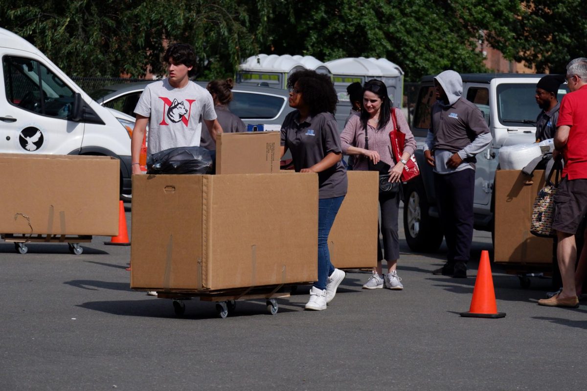 Students load moving hampers as they prepare to move in to on-campus residential halls at the beginning of the fall 2023 semester. Tuition and fees contributed to about 70% of the universitys revenue.