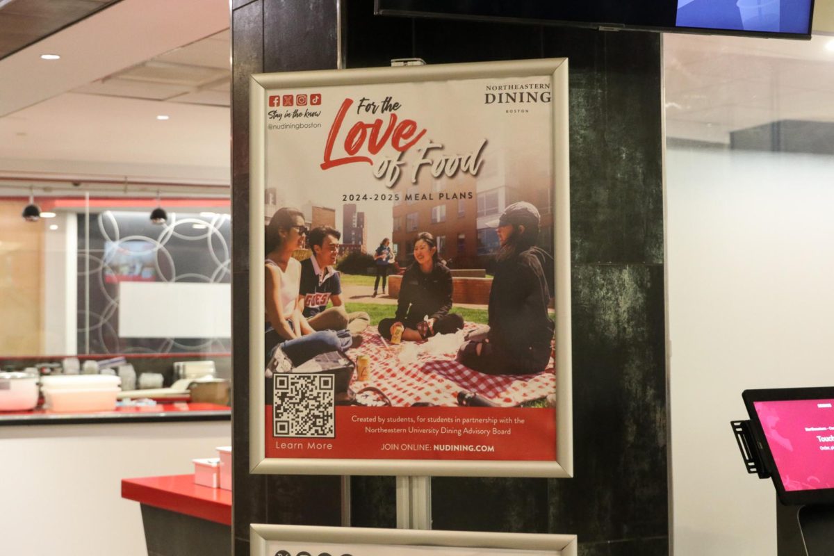 A sign in Curry Student Center advertises Northeastern's revamped dining plans. Northeastern announced the new meal plans will be effective starting this fall semester.