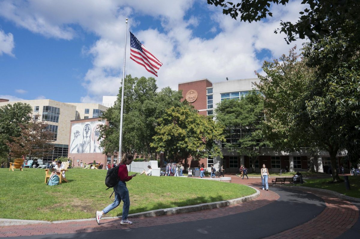 Students walk around and relax on Centennial Common. Many students felt overwhelmed acclimating to Northeastern's campus during their first time in Boston.