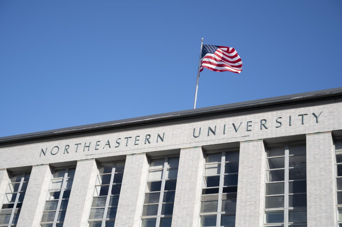 An American flag flies on top of Ell Hall. Northeastern tied with three other universities for the 54th slot in U.S. News & World's annual national college report for 2025.