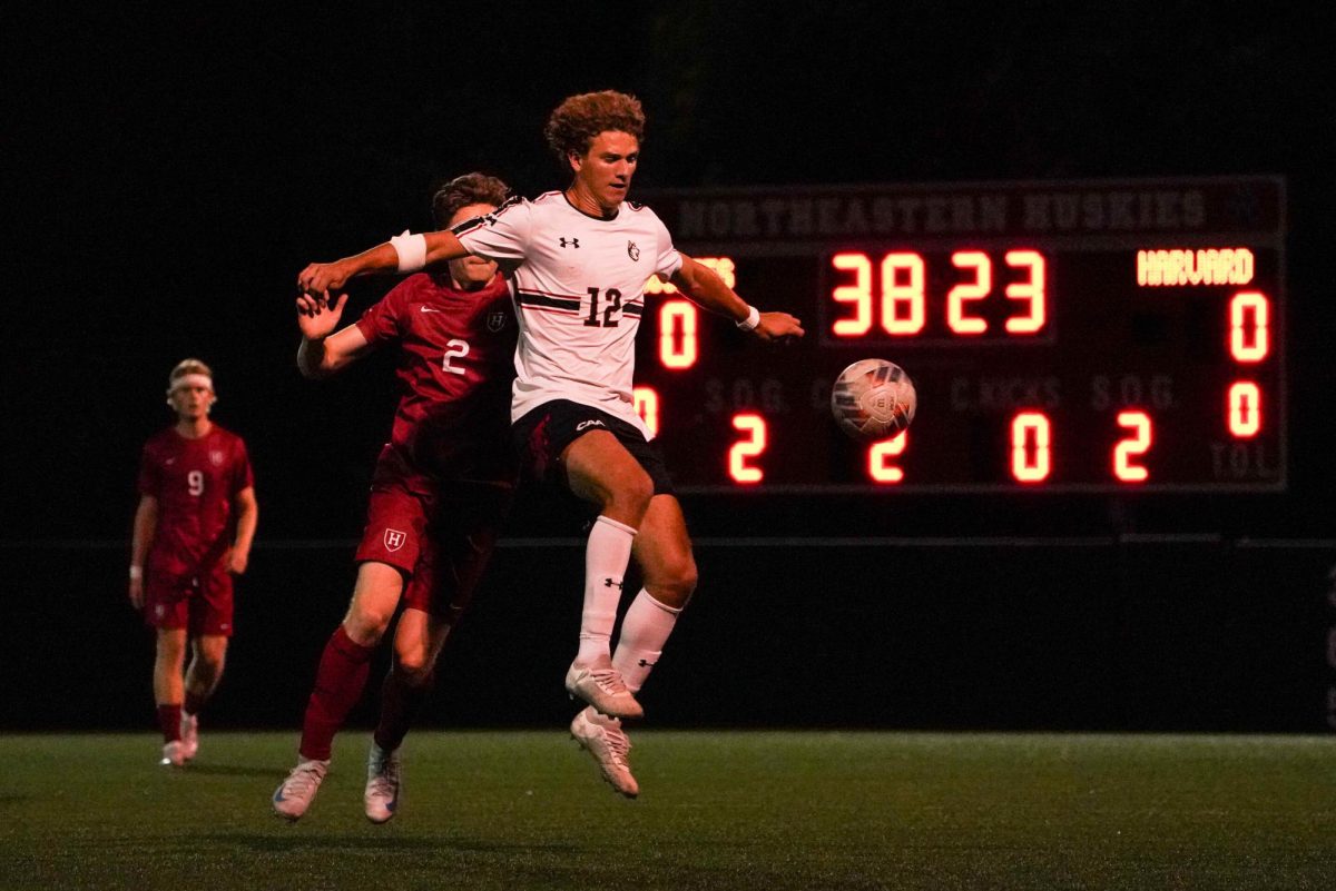 Junior midfielder Kade Tepe keeps his eye on the ball, fighting for possession with a Harvard defender Sept. 17. The Crimson only earned two shots on goal compared to Northeastern’s five in the 0-0 match.