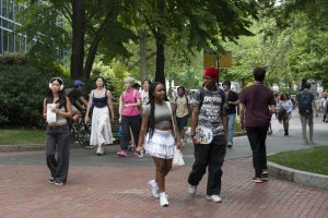 Students walk around Northeastern's Boston campus. Northeastern’s acceptance rate dropped to 5.2% for the Class of 2028 fall 2024 admissions cycle, but students doubt the number is representative of the university’s selectivity and quality.