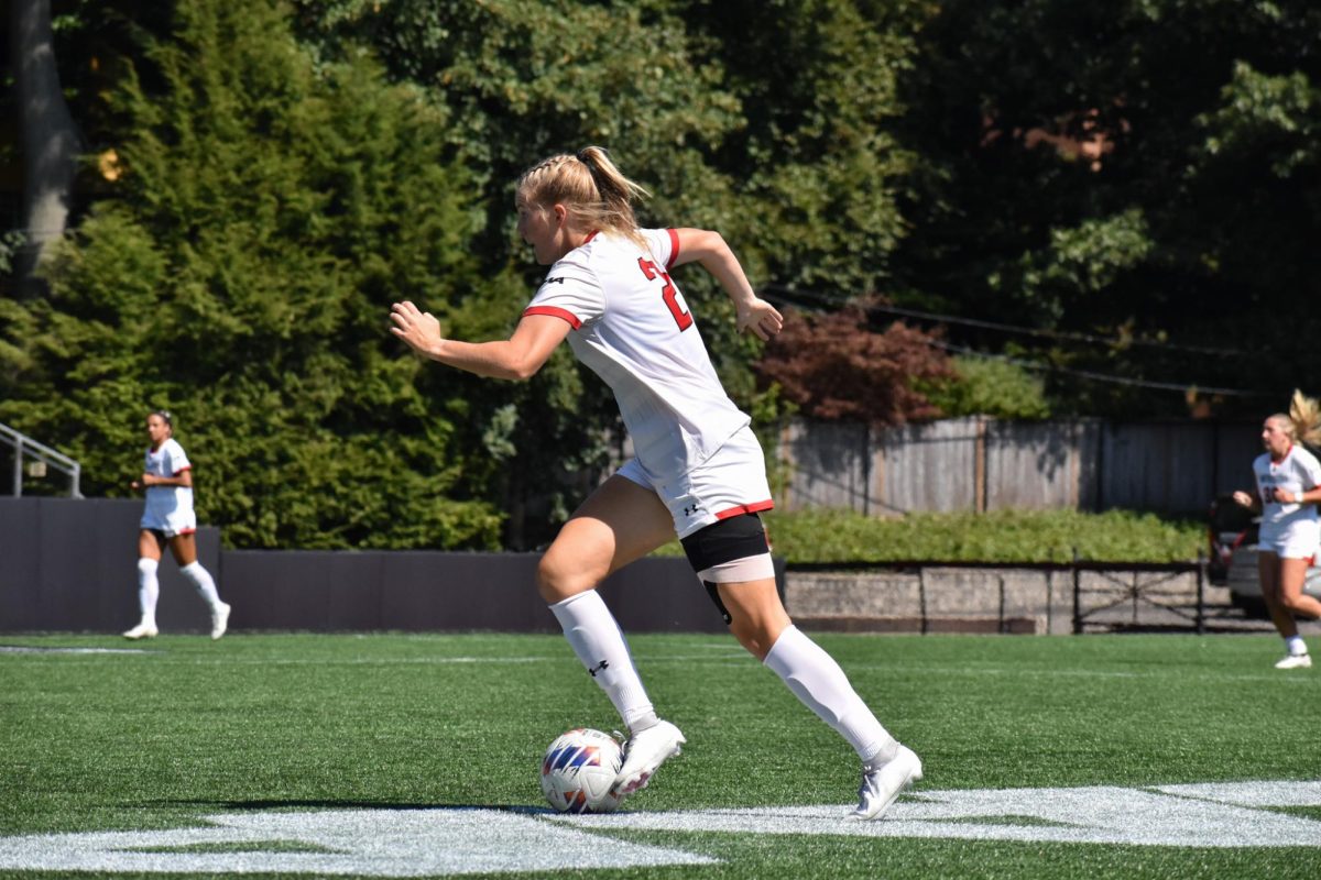 Jessie Hunt dribbles the ball toward Bryant’s defensive third Sept. 15. The Husky, alongside Faith Rosenblatt, assisted Ava Nace in Northeastern’s only goal versus Elon Sept. 22.