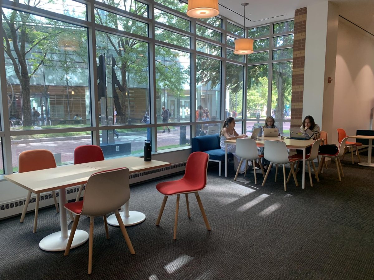 Students complete work in the West Village G lobby. Many students found Snell Library too crowded to study in.