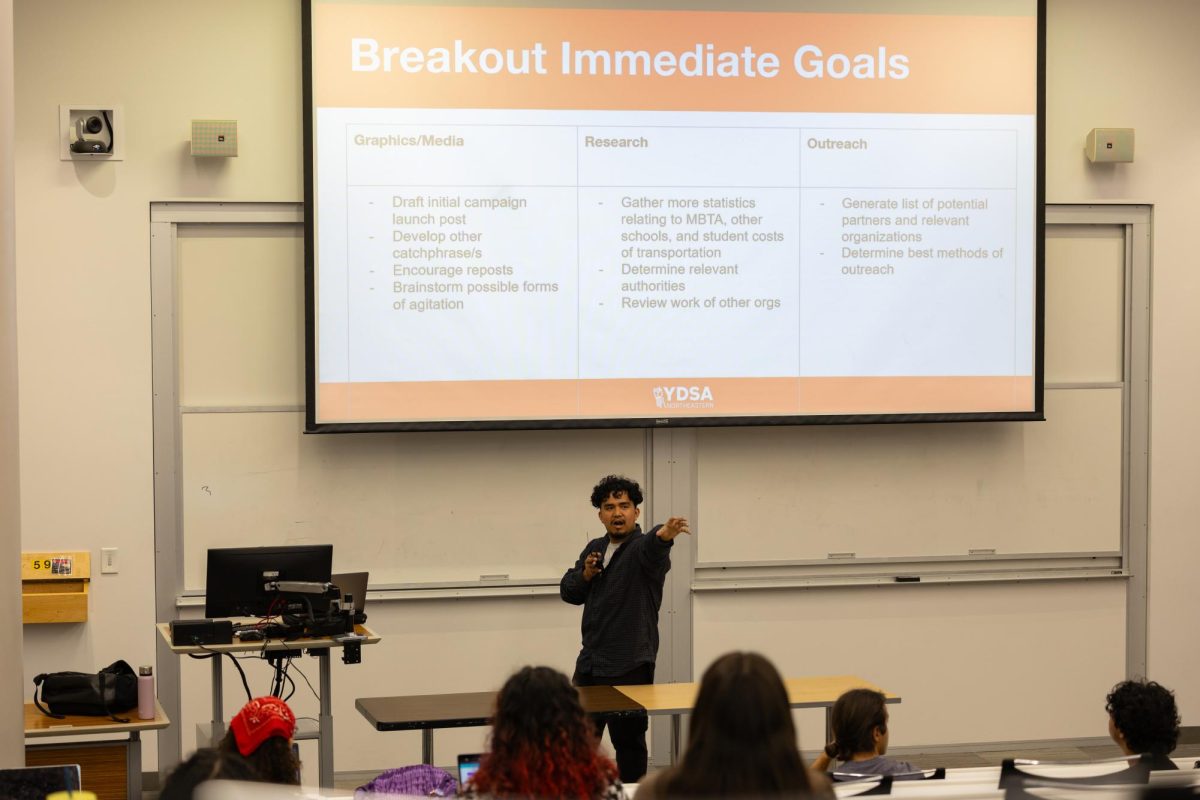 John Cervantes goes over YDSA's goals for each of its three groups involved in the "Free the T" campaign. The campaign was created to urge Northeastern to enroll in the MBTA University Pass Program.