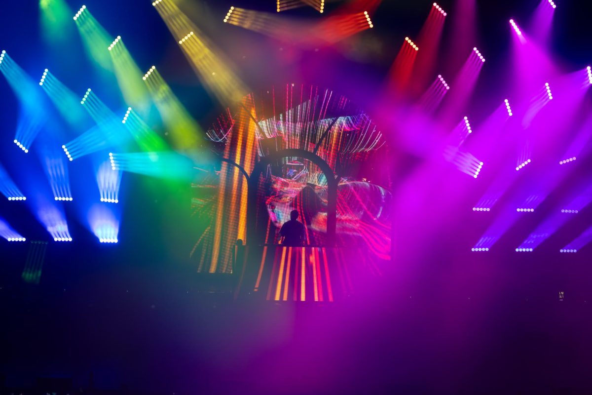 The colors of the rainbow surround Zedd, leaving only his silhouette. This was a callback to his “True Colors” album that experimented with color.