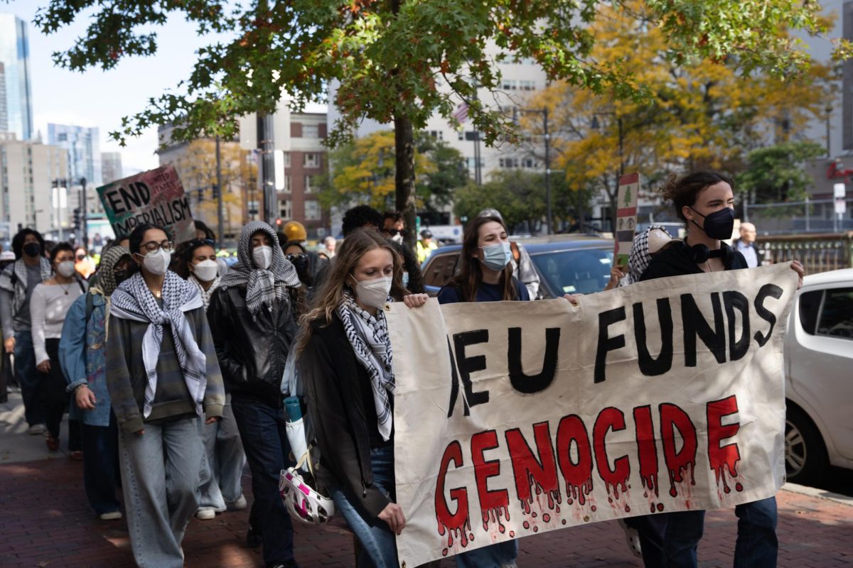 Rally participants march down Huntington Avenue during a protest against Northeastern's all-day career fair Oct. 9. Read more here.