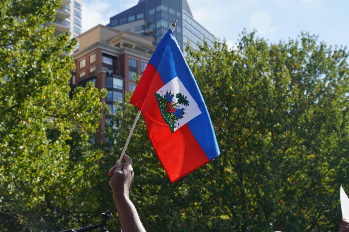 An activist holds a Haitian flag during a Haitian community rally Sept. 24. Read more here.