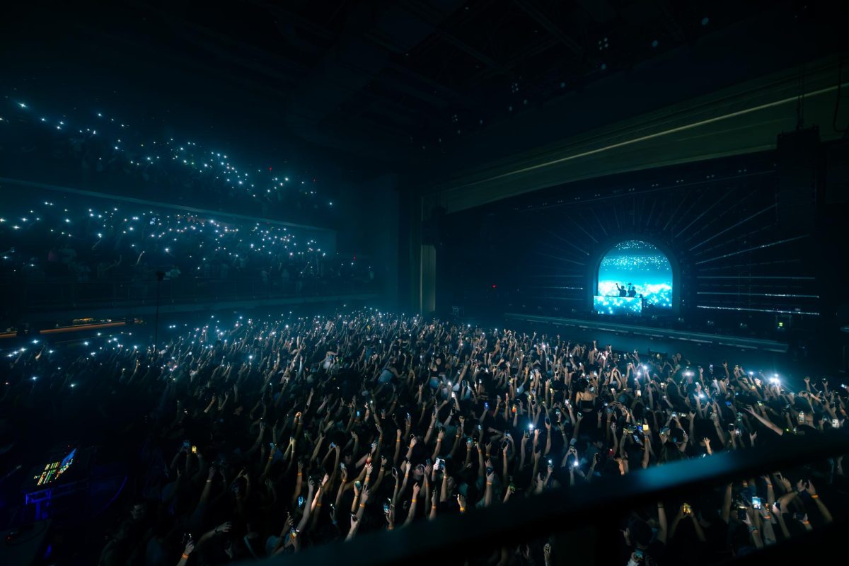 Crowd members put their phones up and sway back and forth during Zedd's "Telos" tour at MGM Music Hall at Fenway Sept. 20. Read more here.