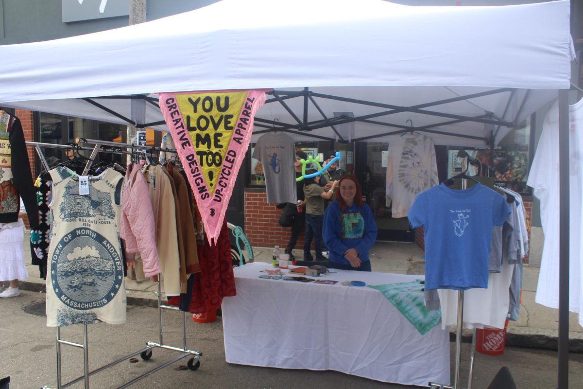 Courtney Ignace stands with her upcycled apparel. The festival featured many different clothing businesses.