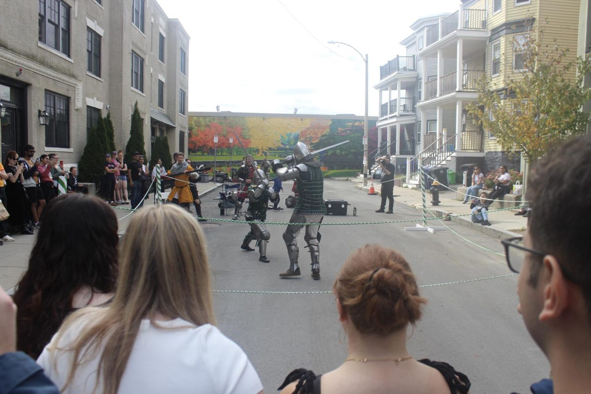 Attendees watch as knights from The North Horde face off on Harvard Terrace. Their only protection was chainmail and metal armor, producing ear-piercing clashing sounds.