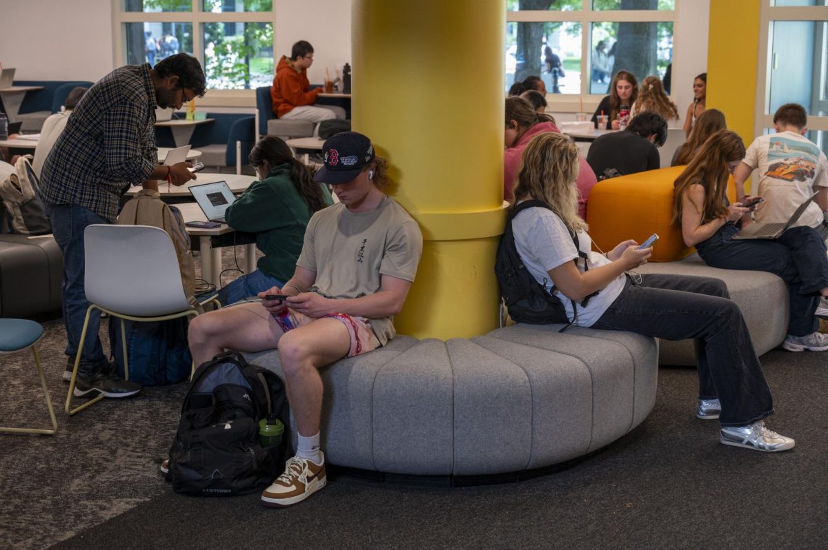 Students in Shillman Hall look at their phones. The rise of instantaneous entertainment on social media platforms reduced children’s attention spans.