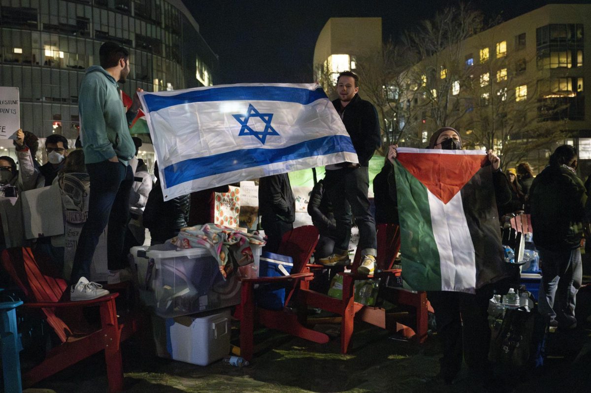 Pro-Israel and Pro-Palestine demonstrators wave their respective flags on Centennial Common April 26. The Pro-Palestine encampment was swept on the third day.