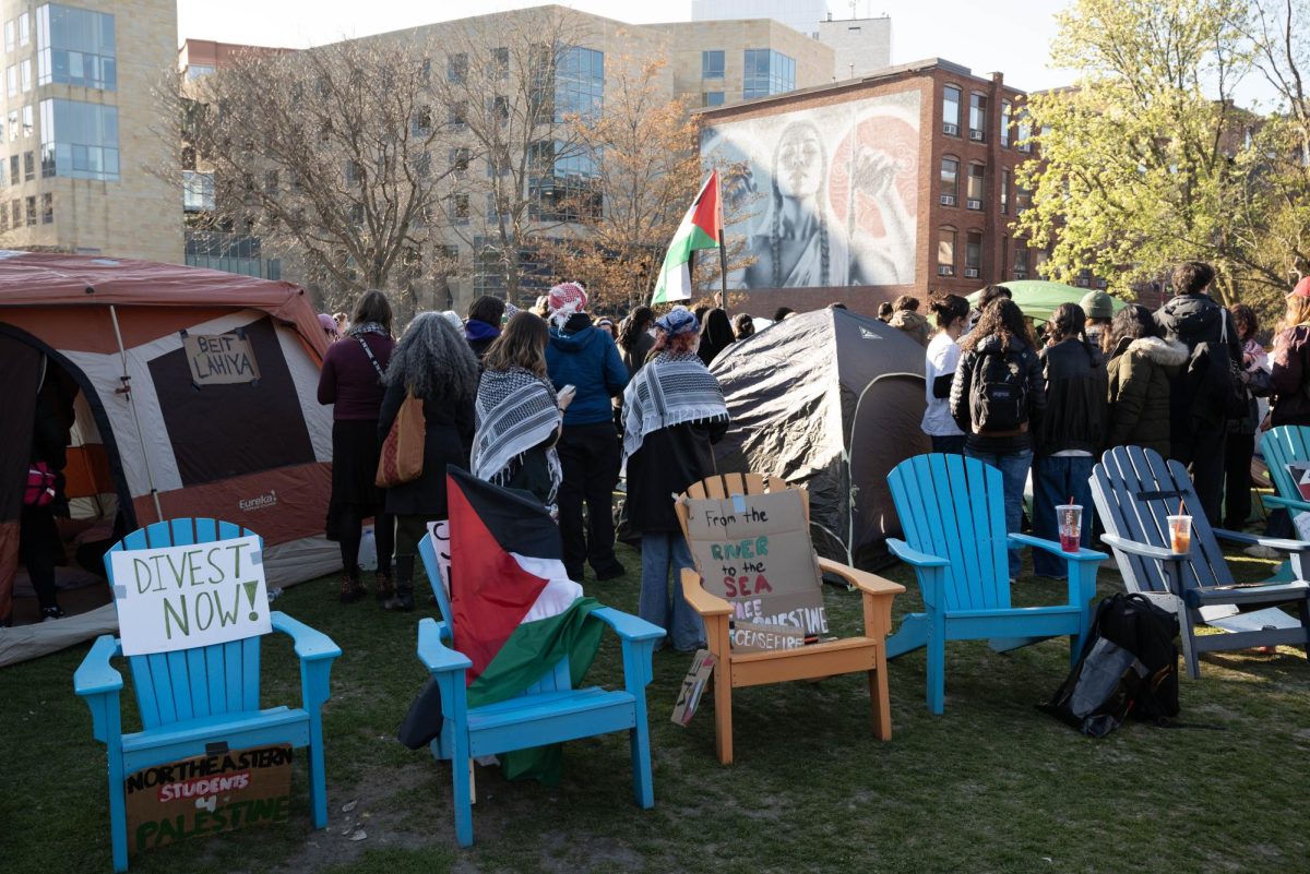 Chairs and protest signs surround the Centennial Common encampment April 26. The demonstration remained peaceful despite a heavy police presence.