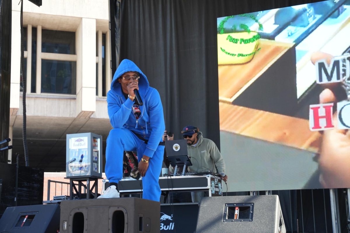 Mell Hooks sings to a crowd. His performance began at 1:10 p.m. and had captivating graphics in the background.