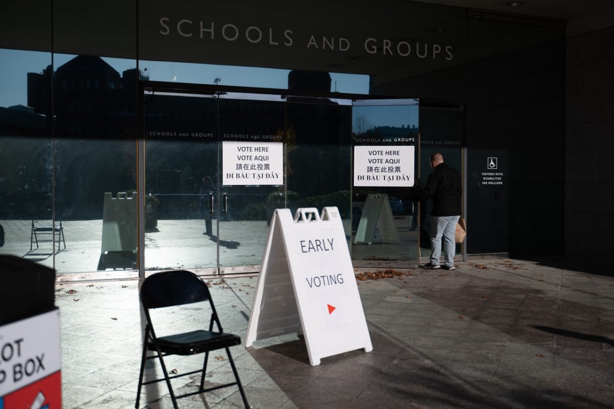 A sign that reads "Early Voting" stands in front of a MFA entrance as a voter walks in. The MFA and the ICA were just two of dozens of early voting locations available throughout Boston.