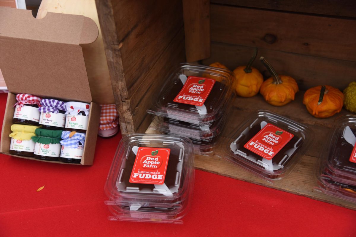 Pre-packed containers of the famous fudge from Red Apple Farm sit next to tiny containers of various jams and jellies. Each treat was made fresh in the heart of North Central Massachusetts.